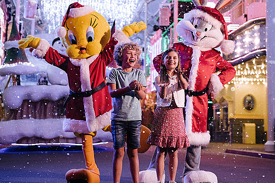 Kids enjoying snow fall with cartoon characters