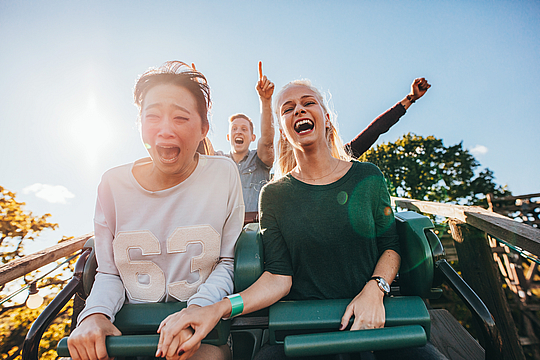 People enjoying Roller coaster